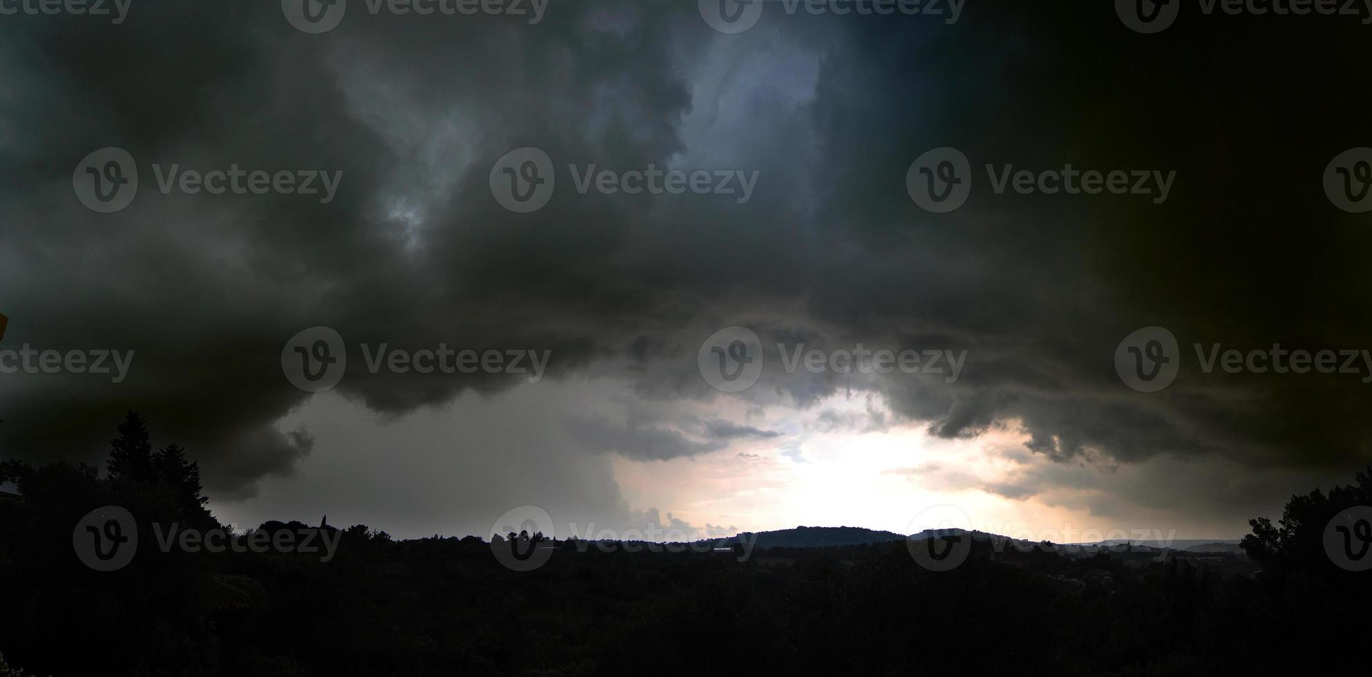 Dramatic sky, cyclone. Gray storm clouds filled with rain. photo