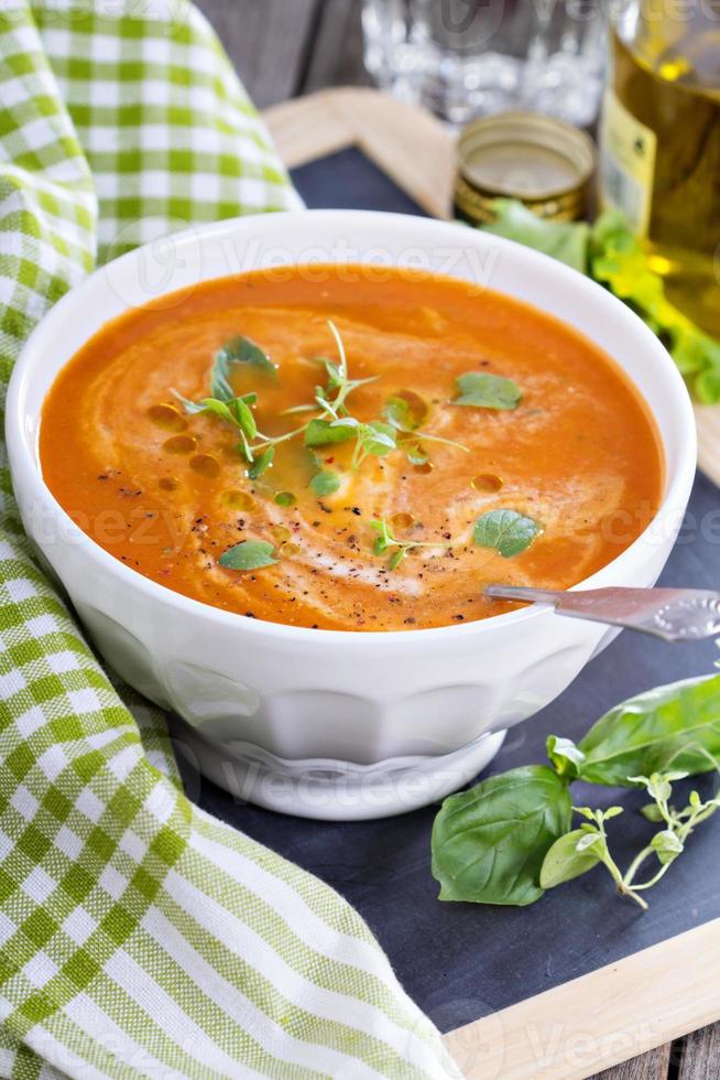 Tomato soup in white bowl photo