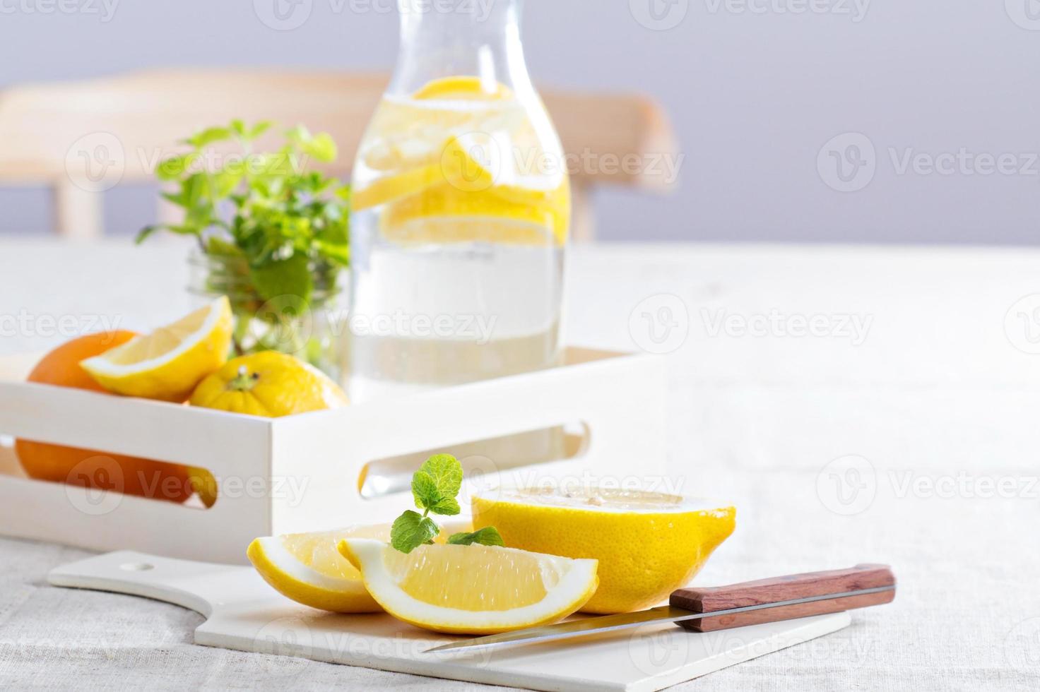 Cut lemons on a cutting board photo