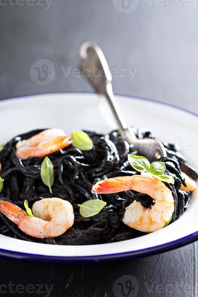 Squid ink homemade pasta with shrimp photo