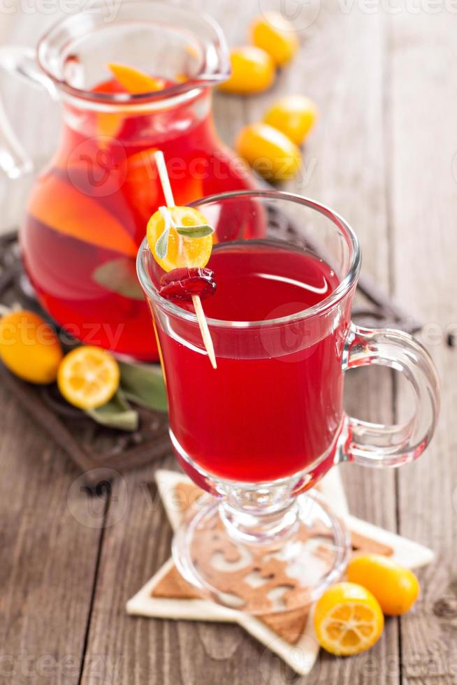 Cranberry and orange holiday punch with sage photo