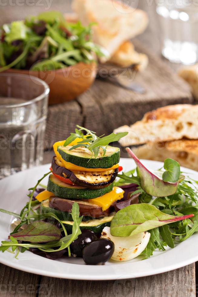 Grilled vegetables stacked on plate photo