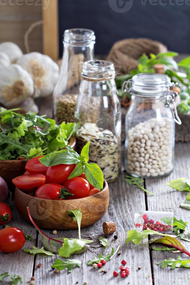 Tomatoes, salad leaves, beans and rice photo