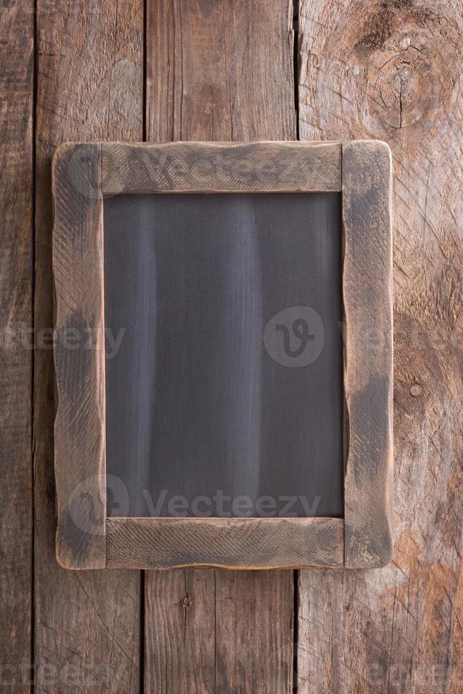 Wooden rustic background with a chalkboard photo