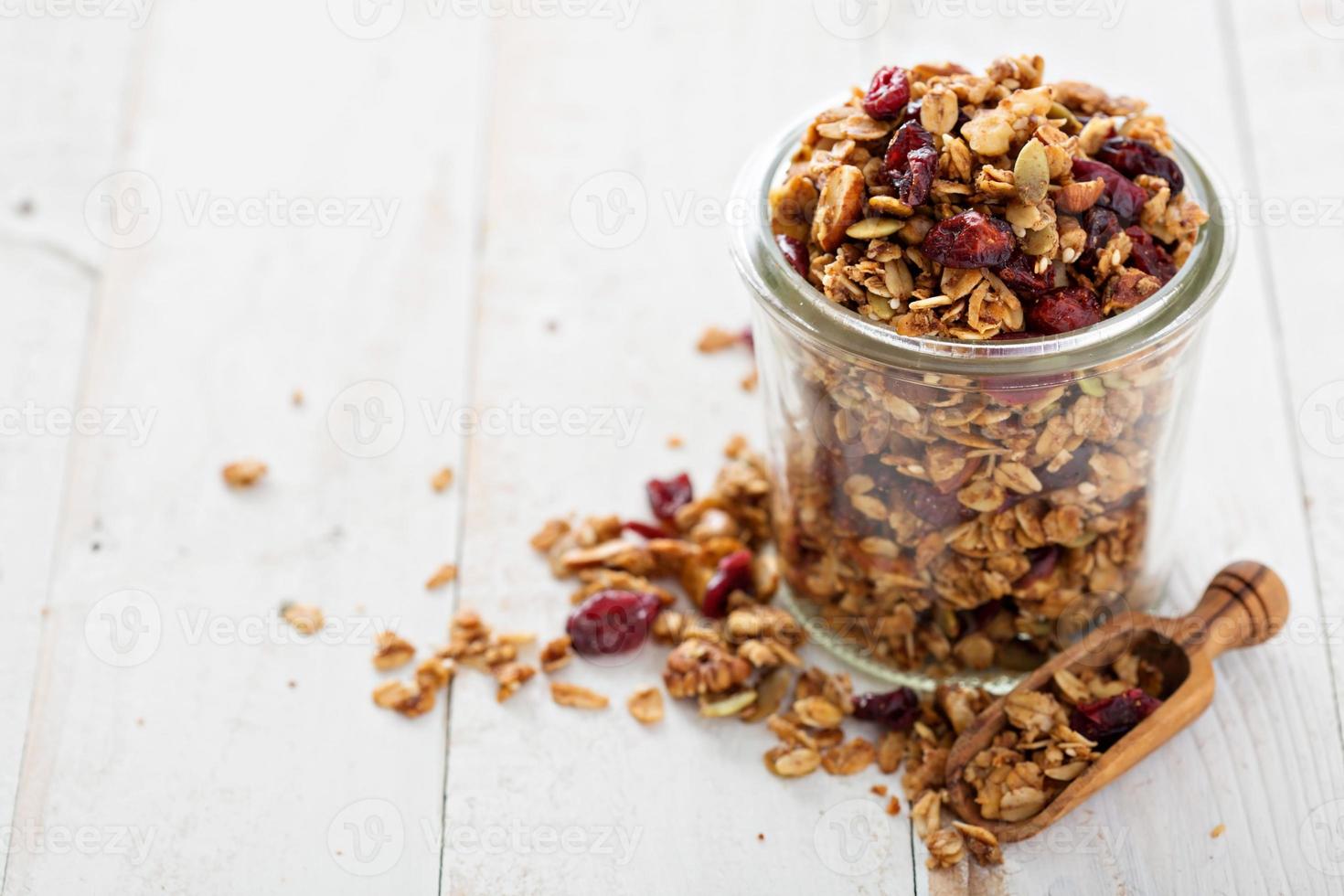 Homemade granola in a glass jar photo