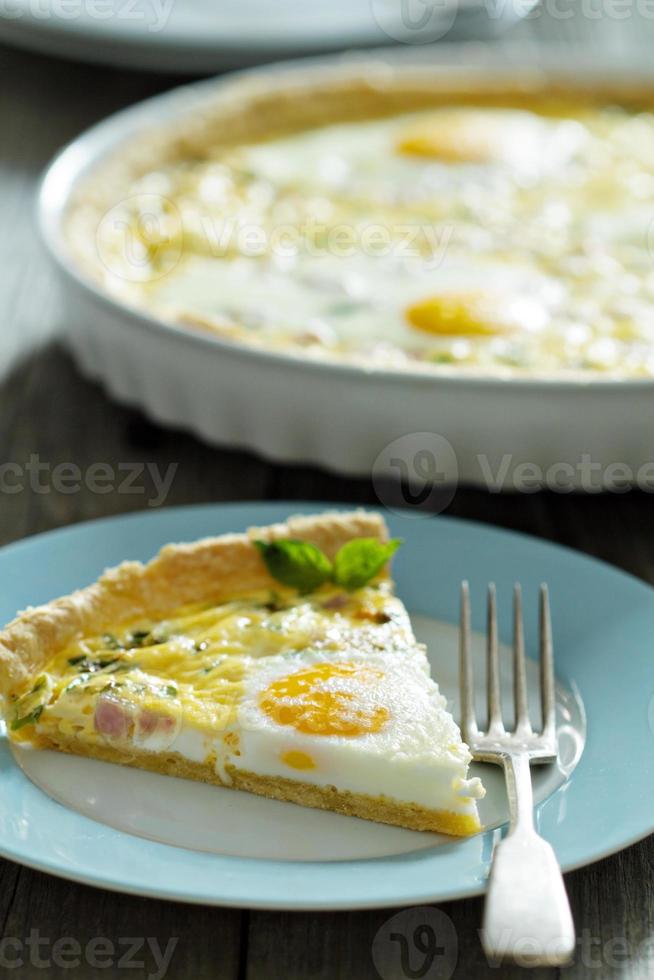 Quiche with ham and eggs photo