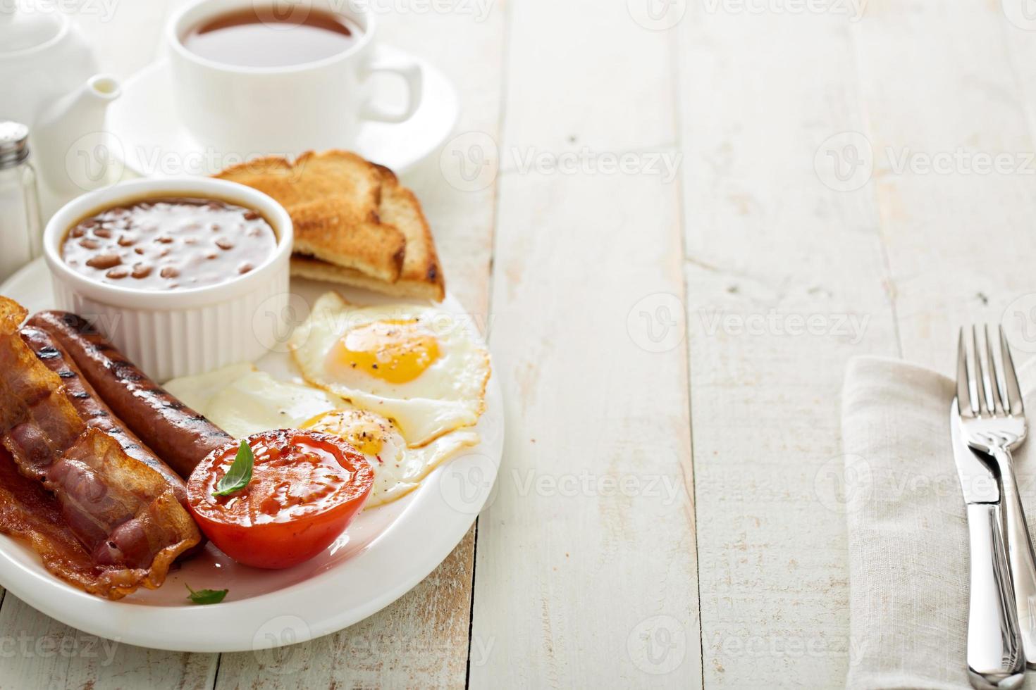 Full english breakfast with egg and bacon photo