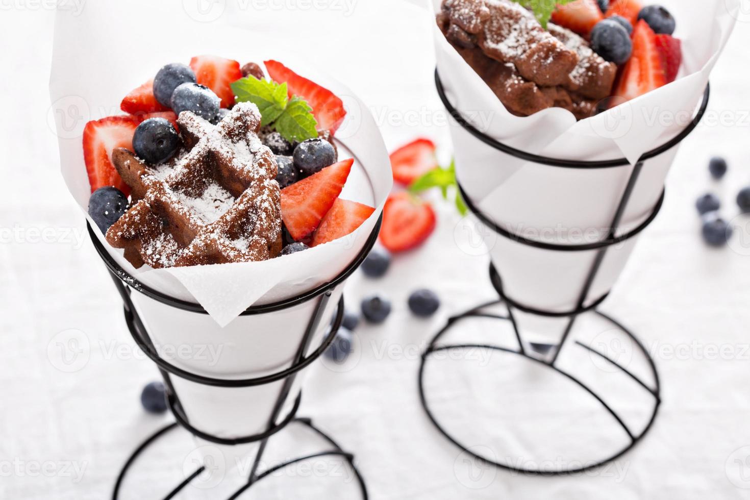 Small chocolate waffles in cones photo