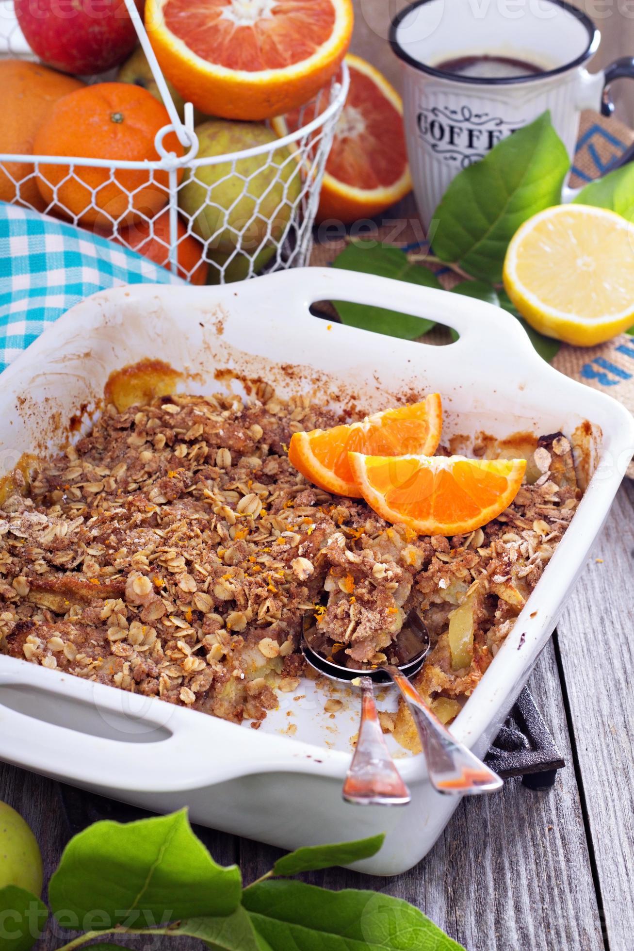 Orange and apple crumble with oats 15701933 Stock Photo at Vecteezy