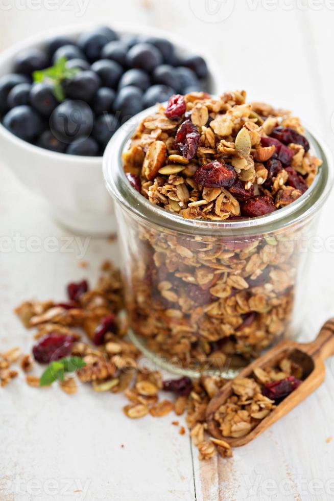 Homemade granola in a glass jar photo