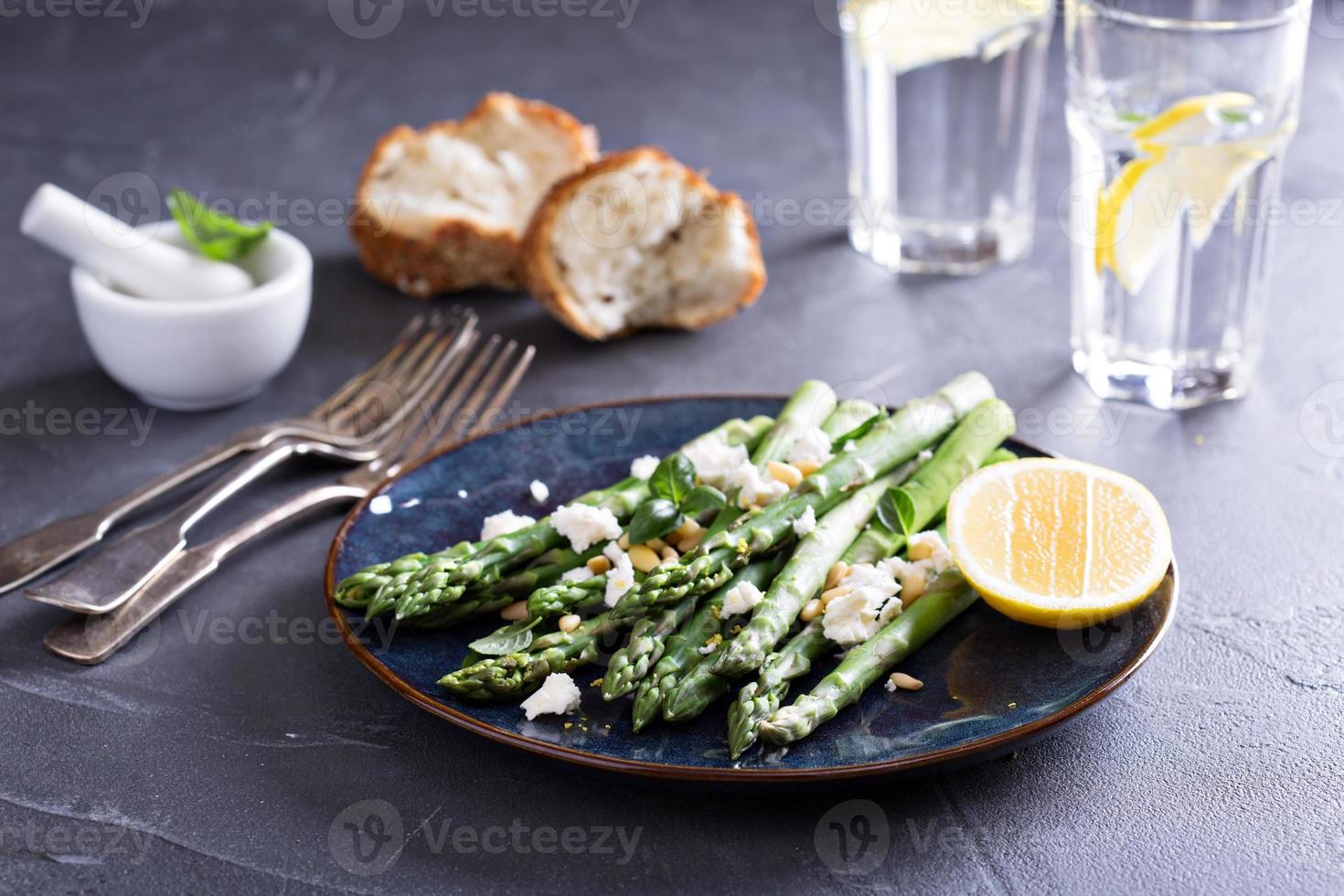 Warm salad with asparagus, feta cheese and lemon photo