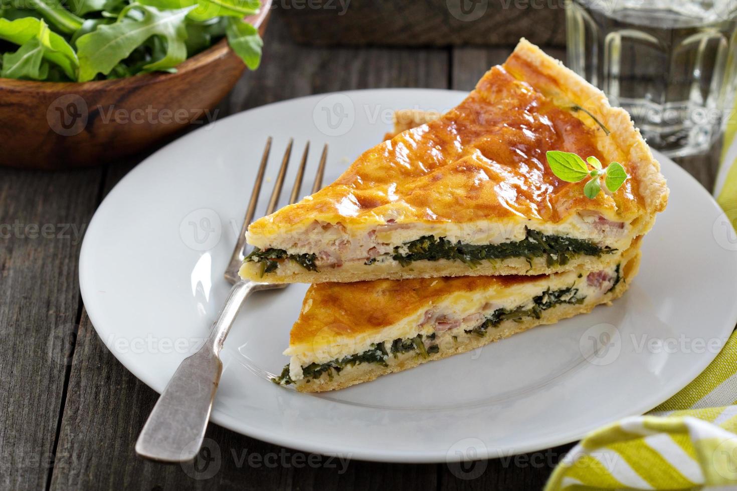 Quiche with arugula and bacon photo