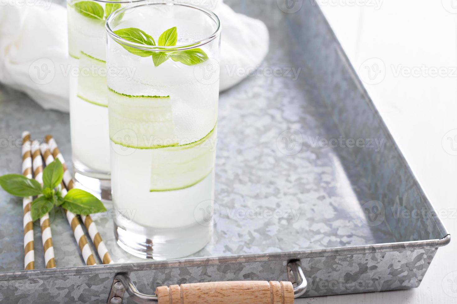 Basil cucumber sparkling drink in tall glasses photo