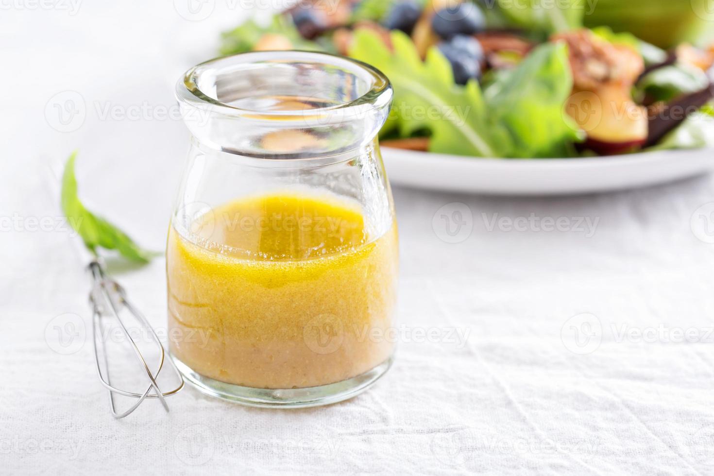 Salad dressing with olive oil and vinegar photo