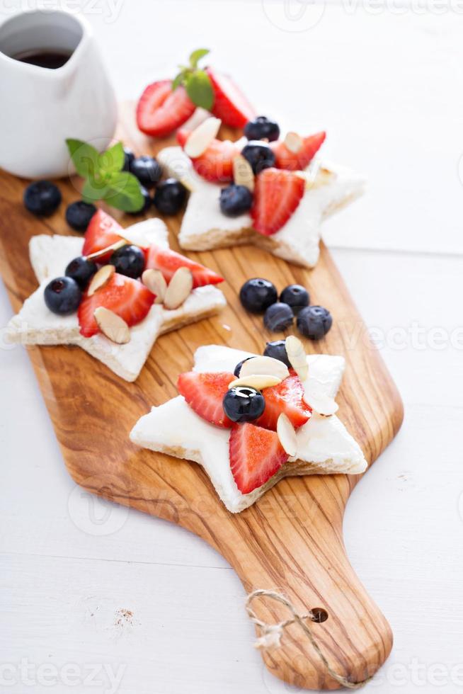 Star shaped sandwiches with berries and cheese photo