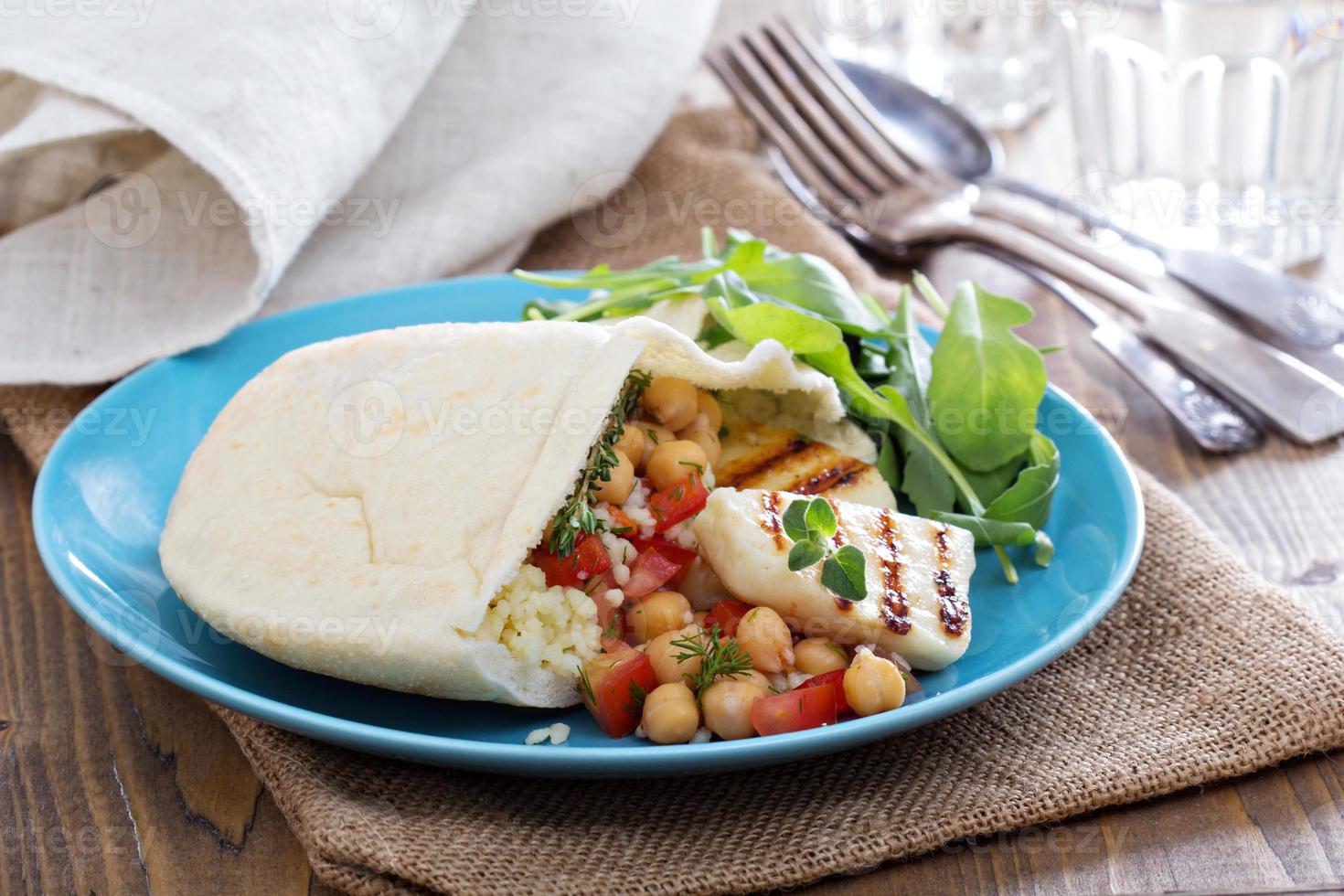 Pita bread with couscous and chickpeas photo