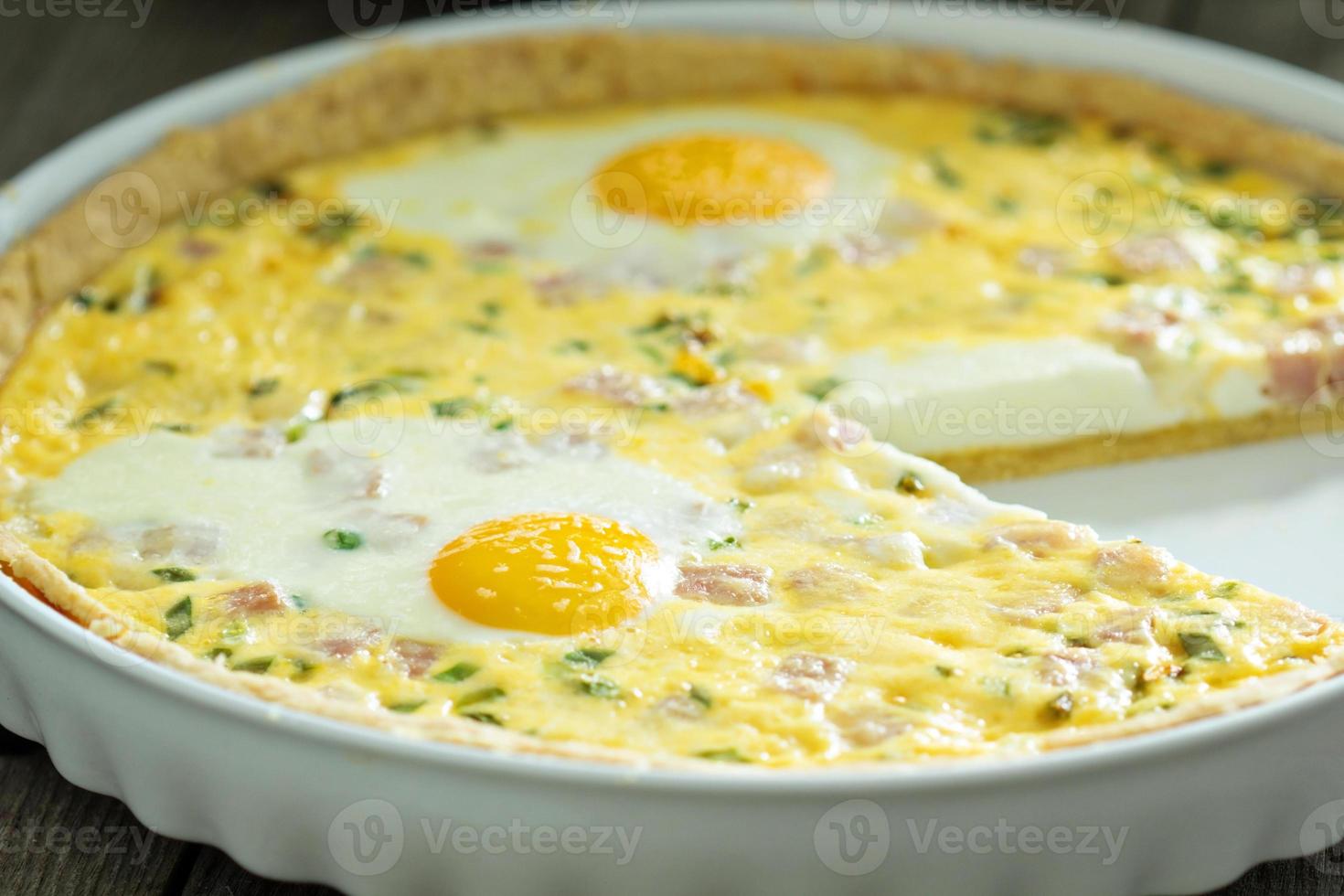 Quiche with ham and eggs photo