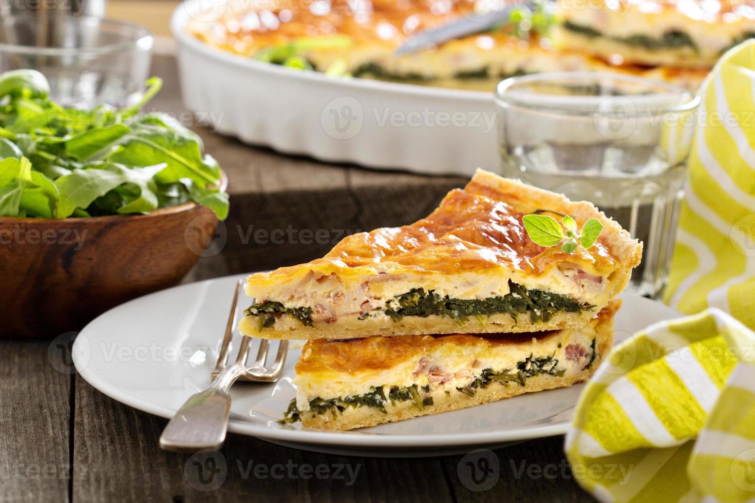 Quiche with arugula and bacon photo