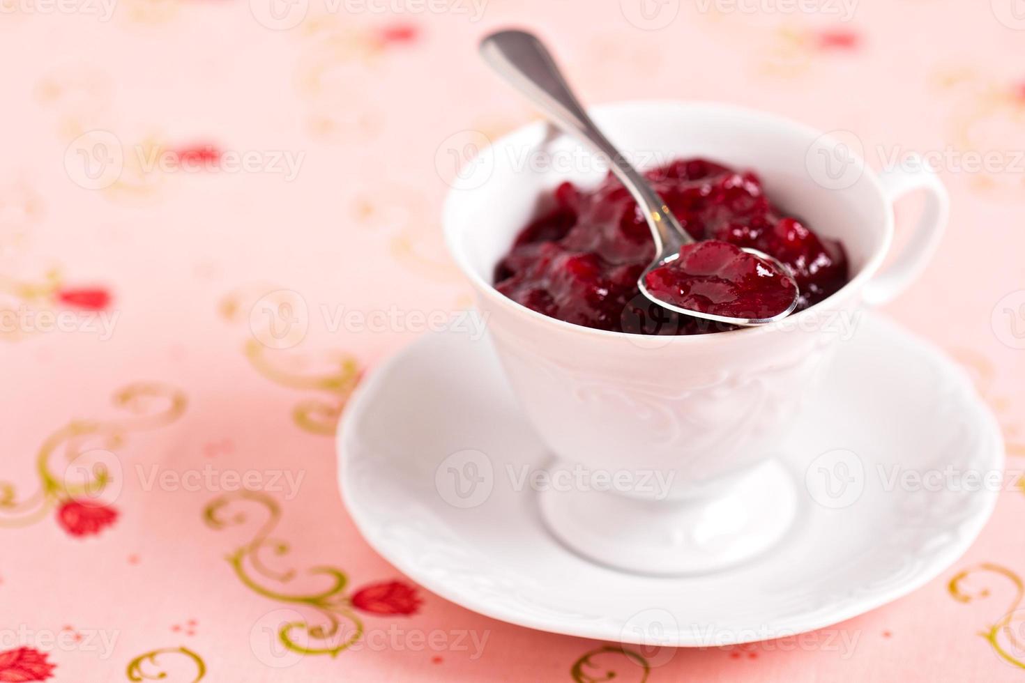 Homemade cranberry sauce in a cup, holiday recipe photo