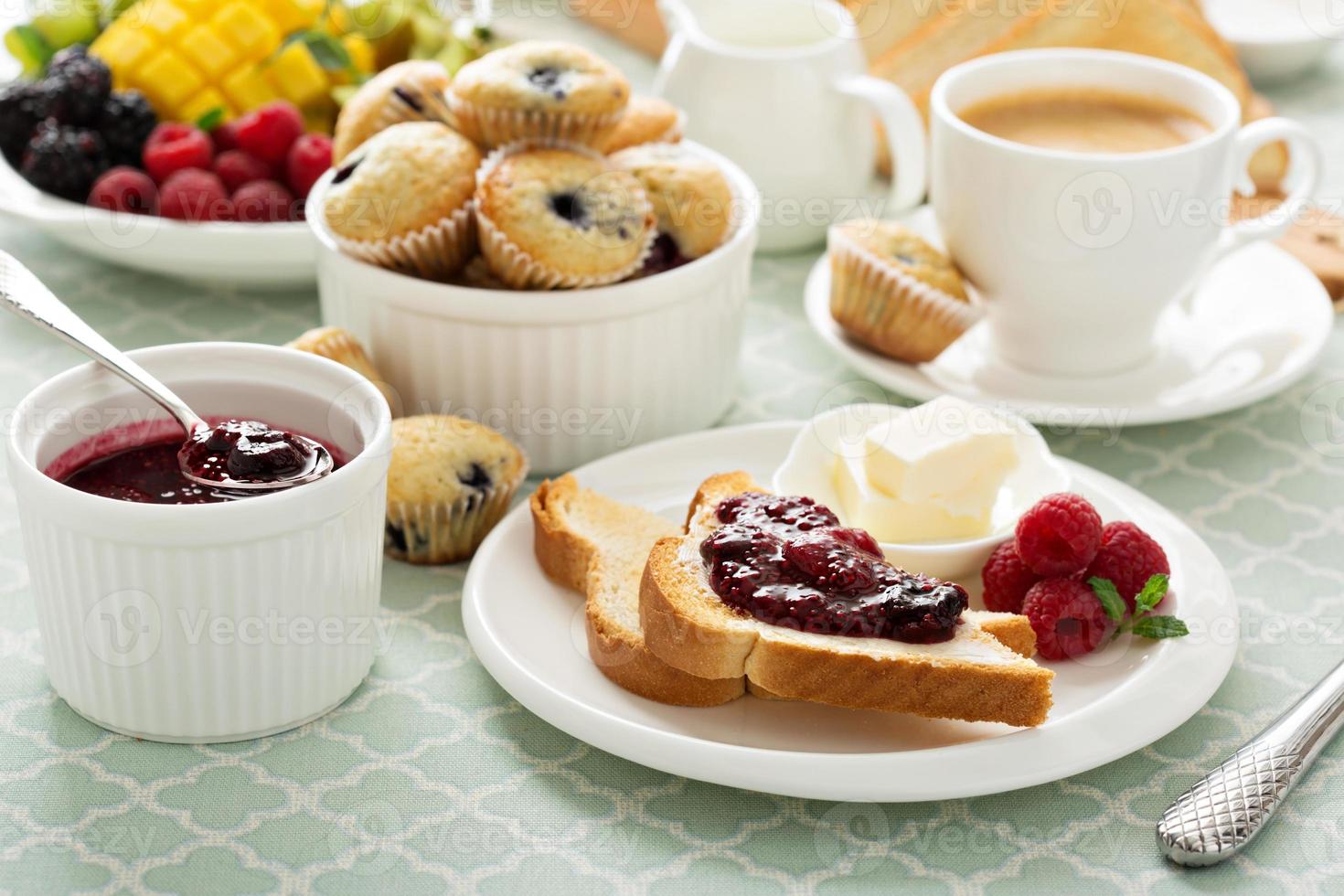 Fresh and bright continental breakfast table photo