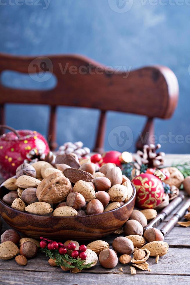 Variety of nuts with shells in a bowl photo