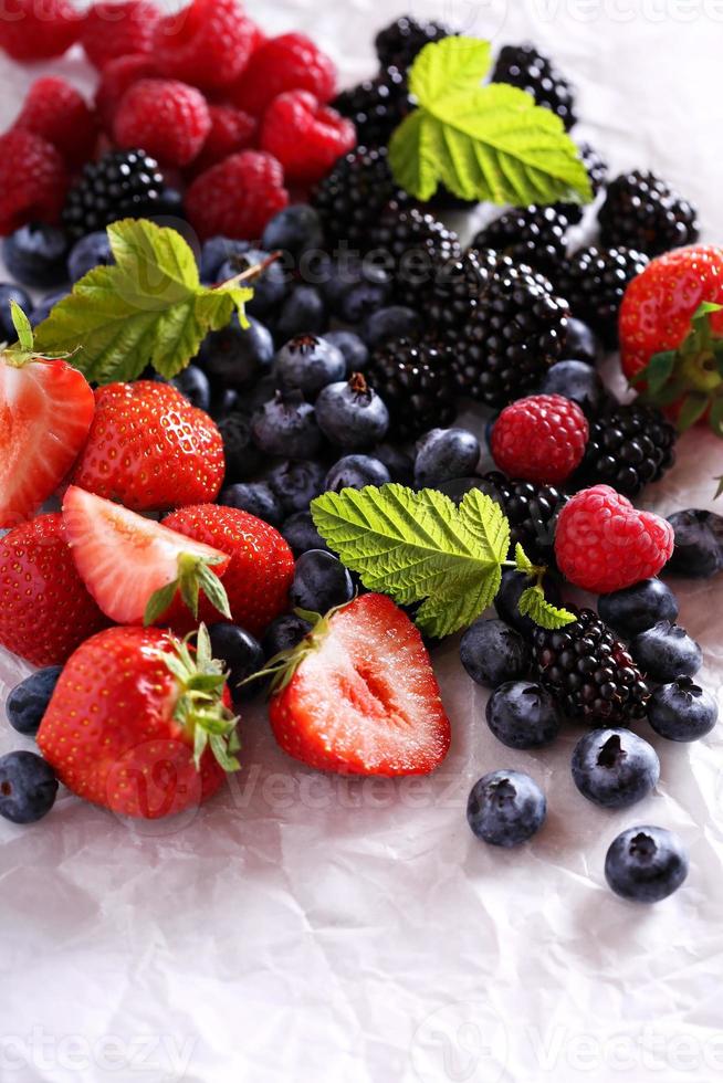 Variety of summer berries on white photo