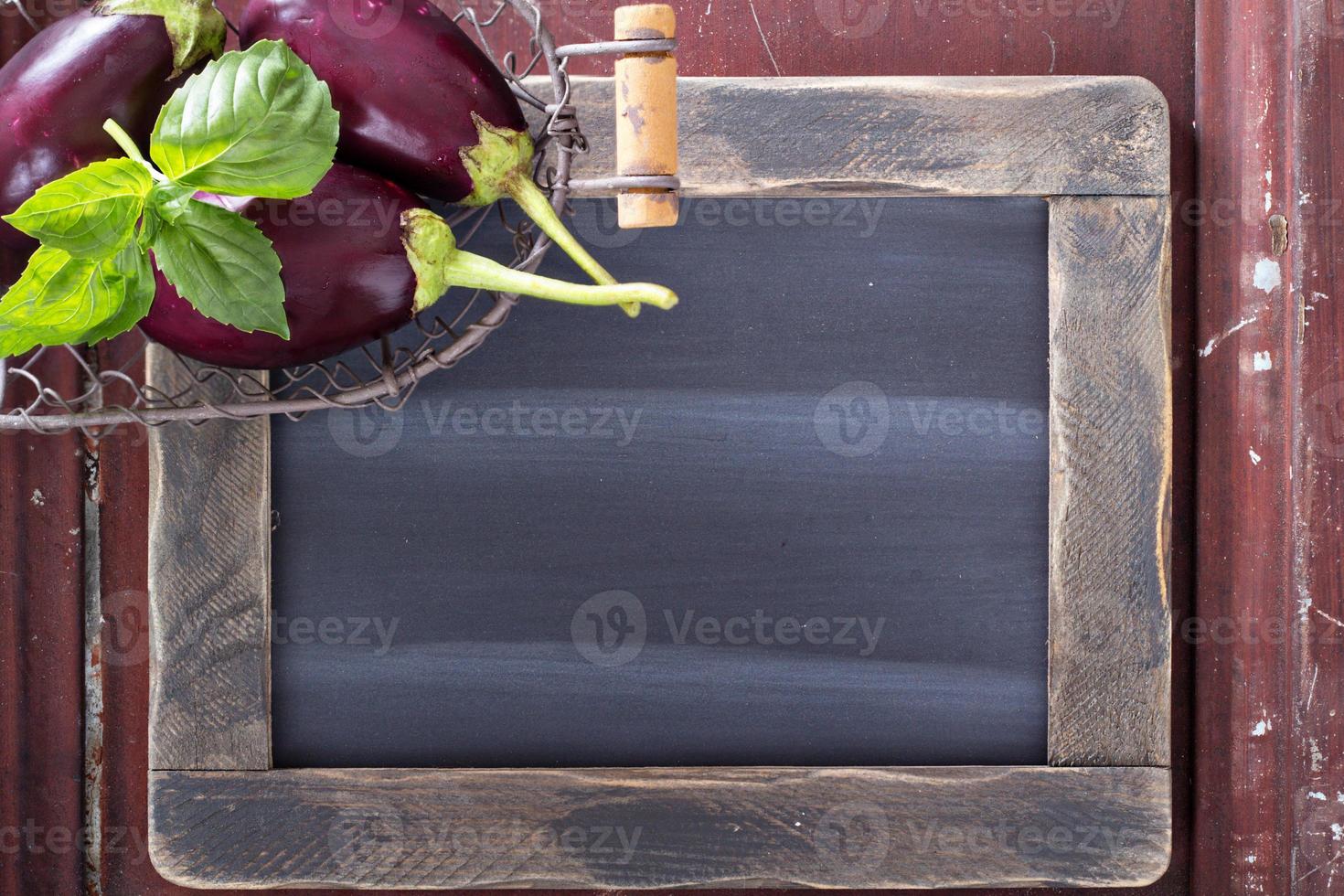 Chalkboard with vegetables on the side photo