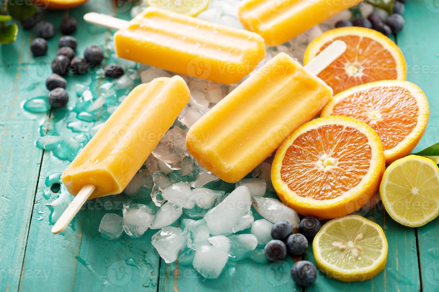 Mango banana popsicles on ice photo