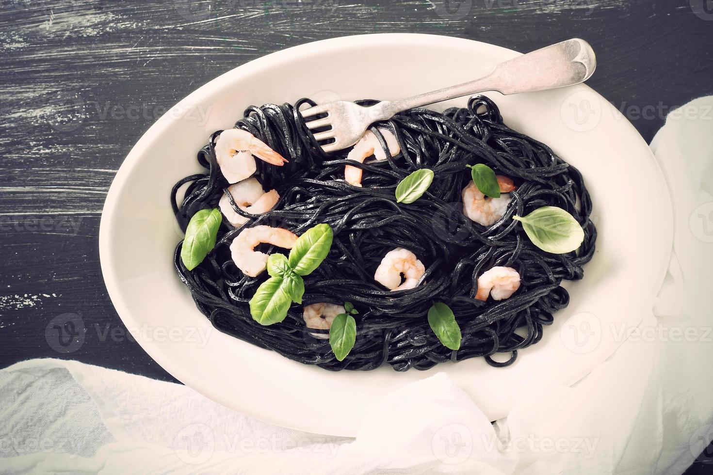 Squid ink homemade pasta with shrimp photo