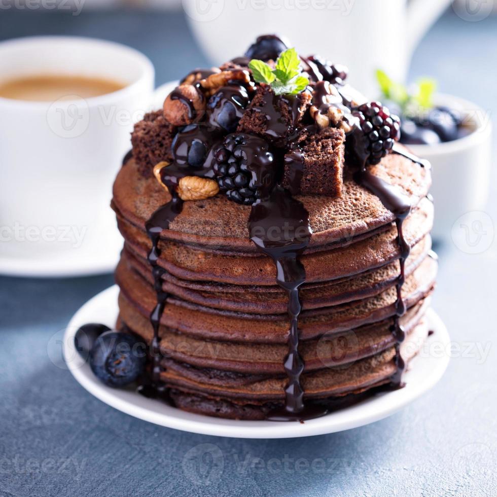 Stack of chocolate pancakes with toppings photo