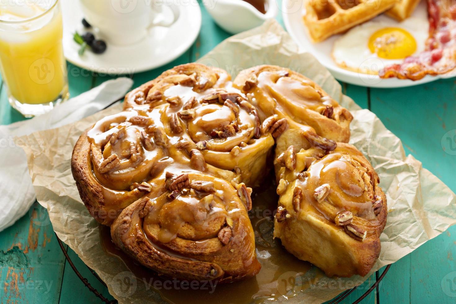 Sticky pecan buns on breakfast table photo