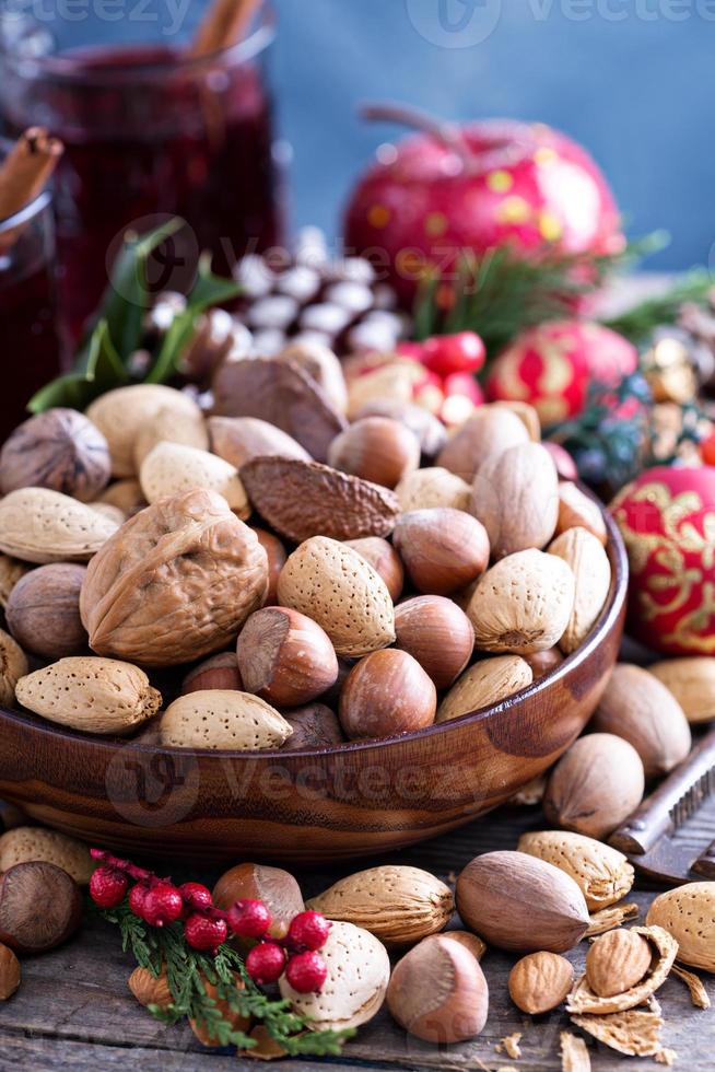 Variety of nuts with shells in a bowl photo