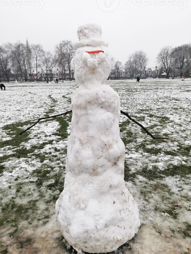 Snowman in a Cold Winter Park photo