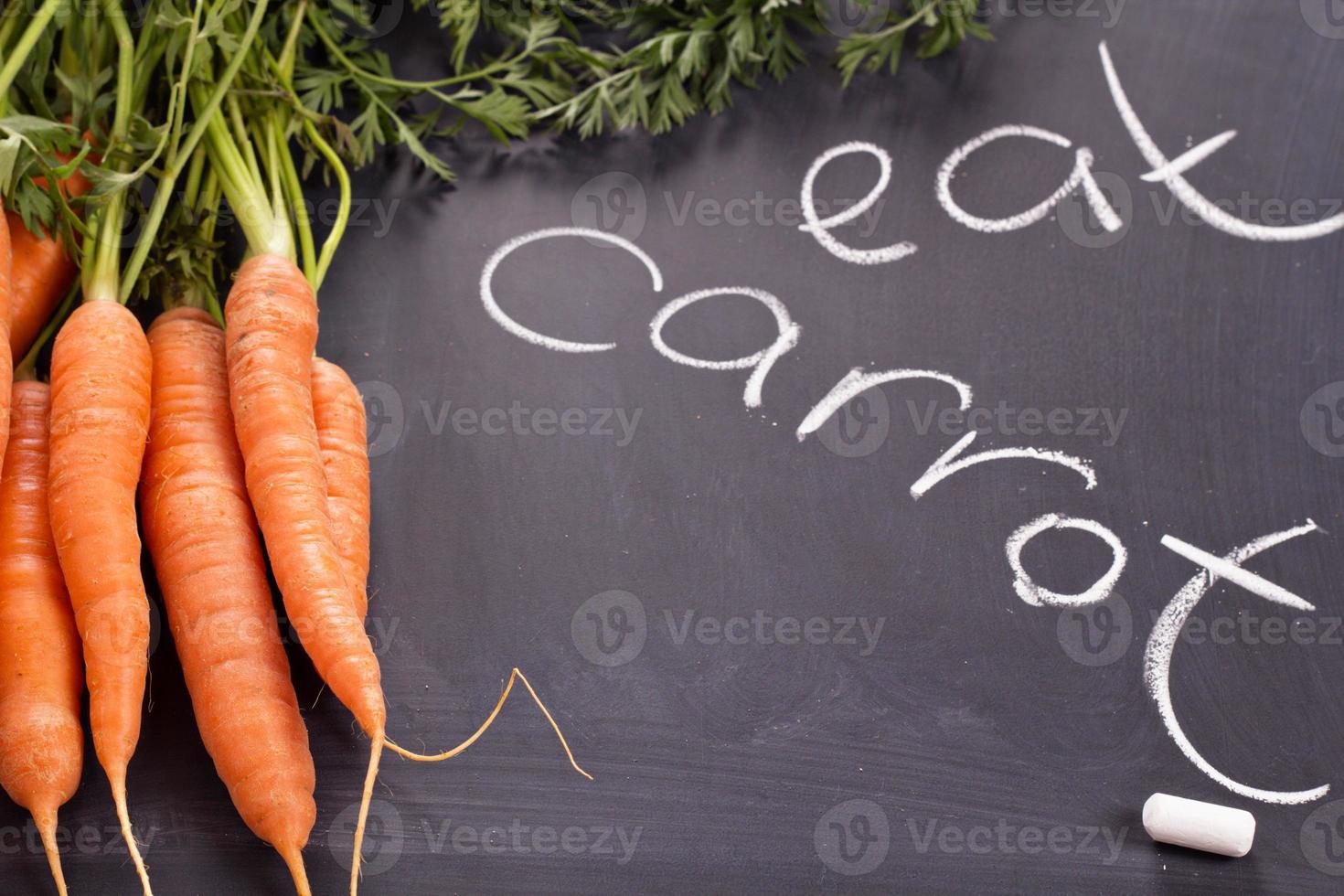 Fresh carrot with green leaves photo