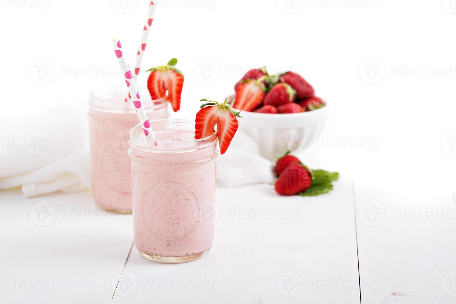 Strawberry milkshake in mason jars photo