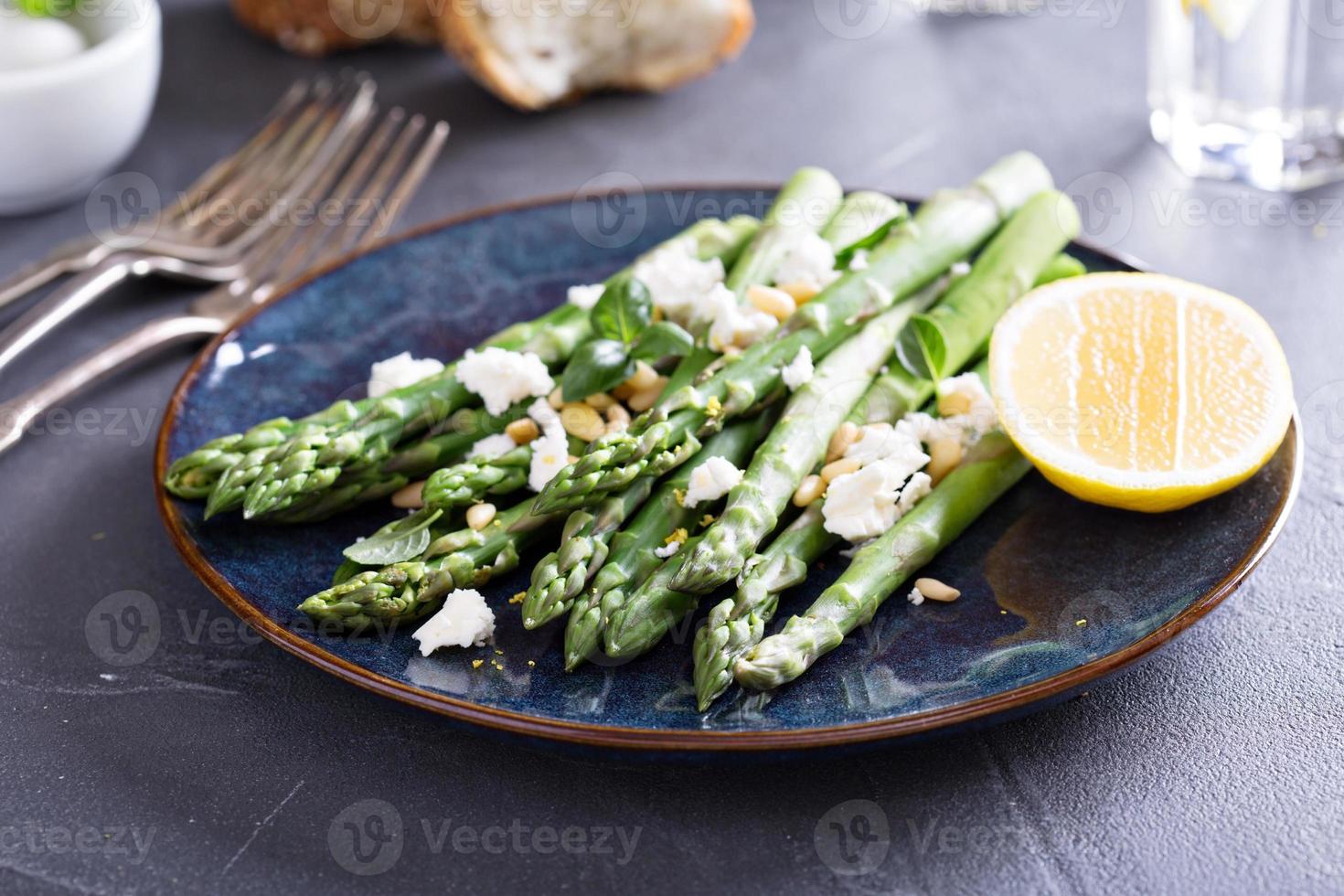 Warm salad with asparagus, feta cheese and lemon photo
