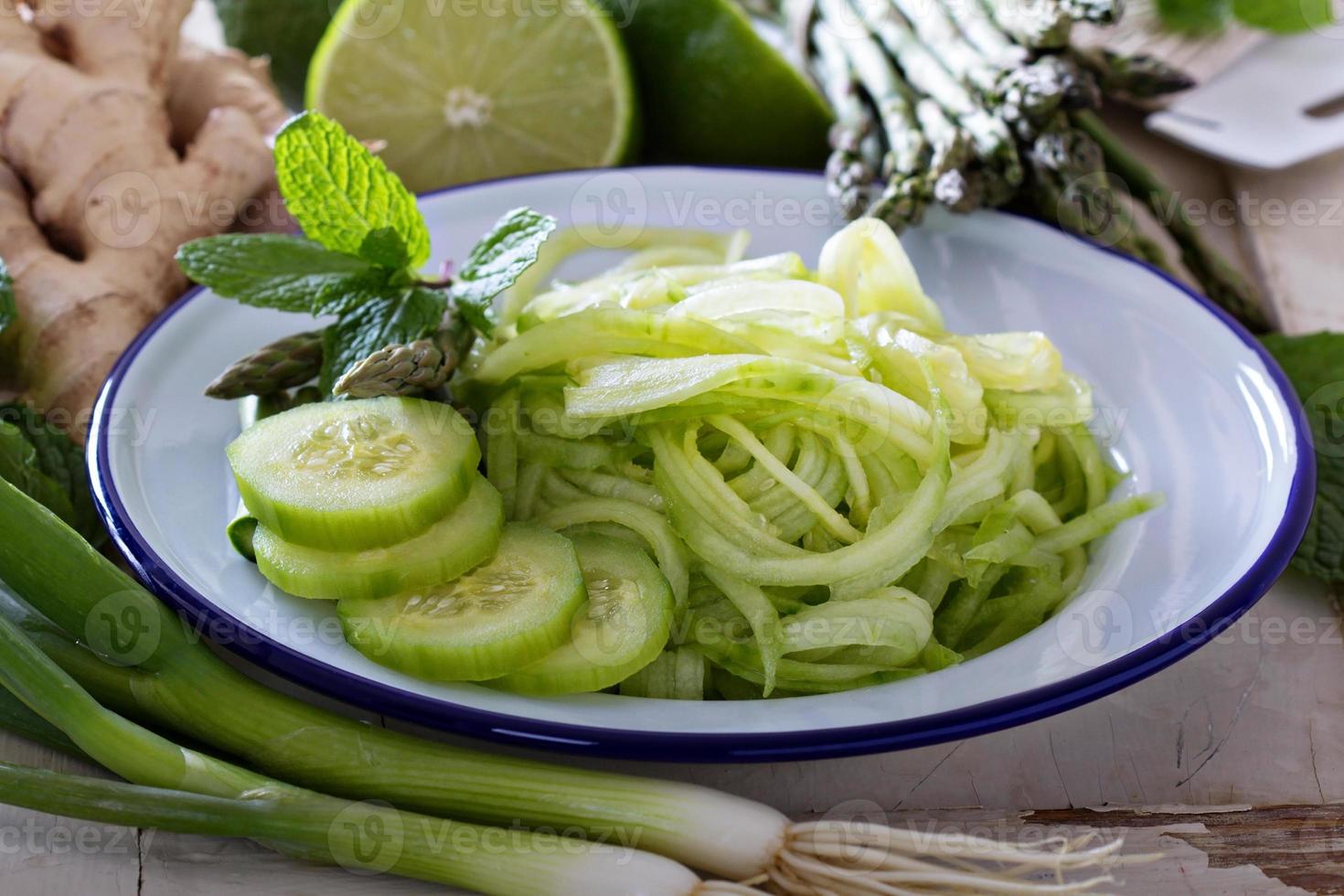Cucumber noodles and green vegetables photo