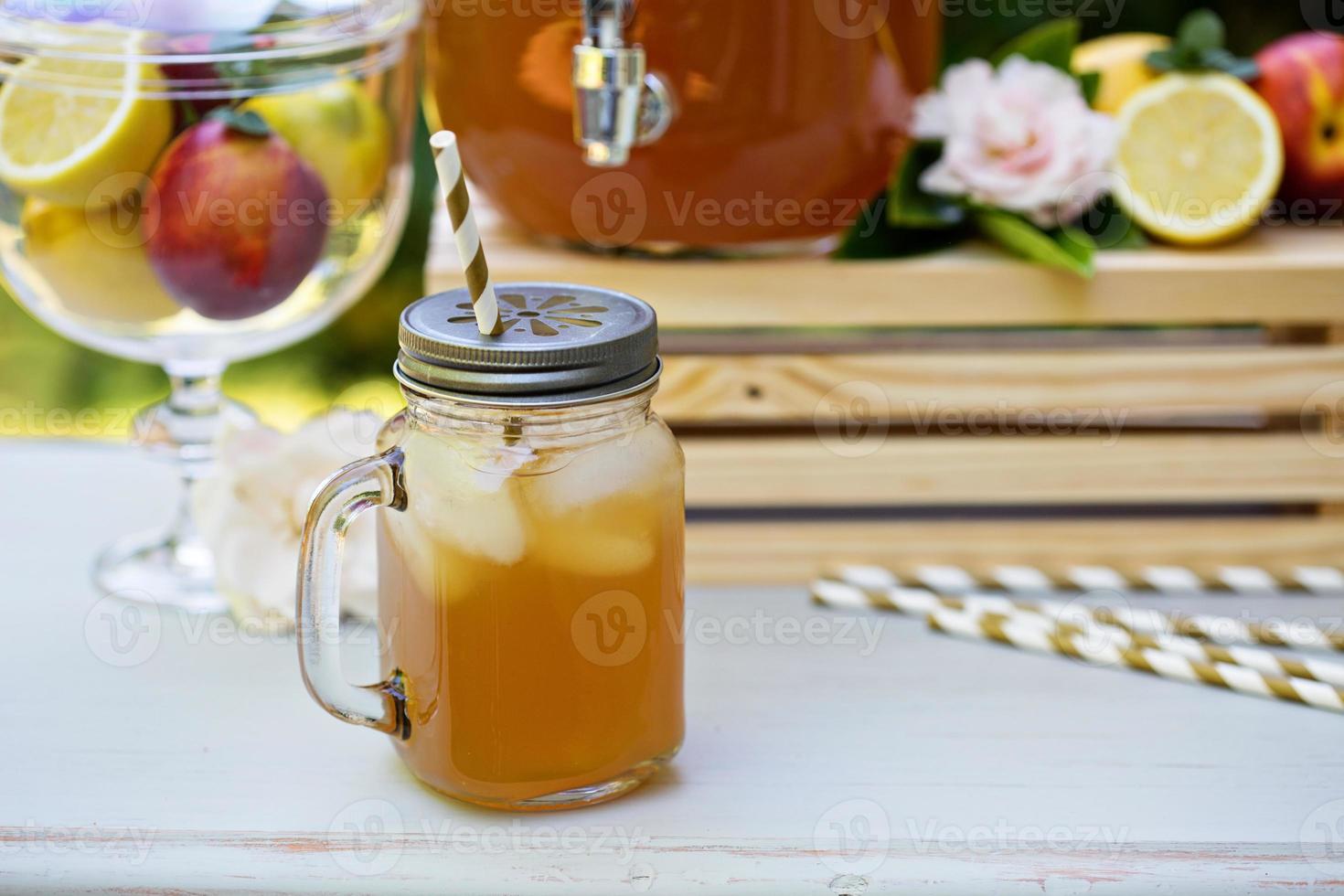 Peach cardamom lemonade with ice cubes photo