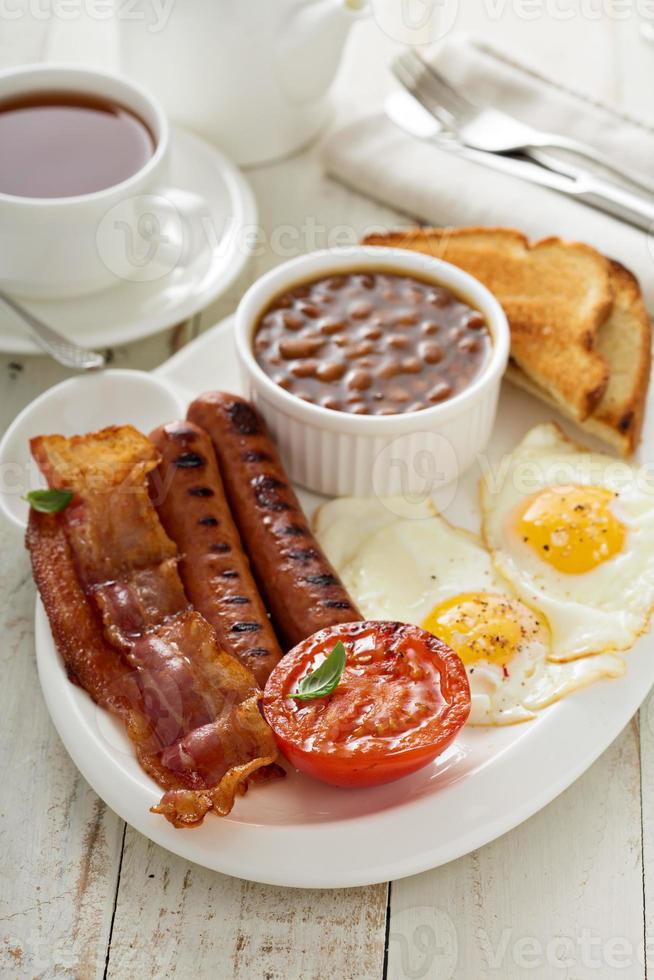 Full english breakfast with egg and bacon photo
