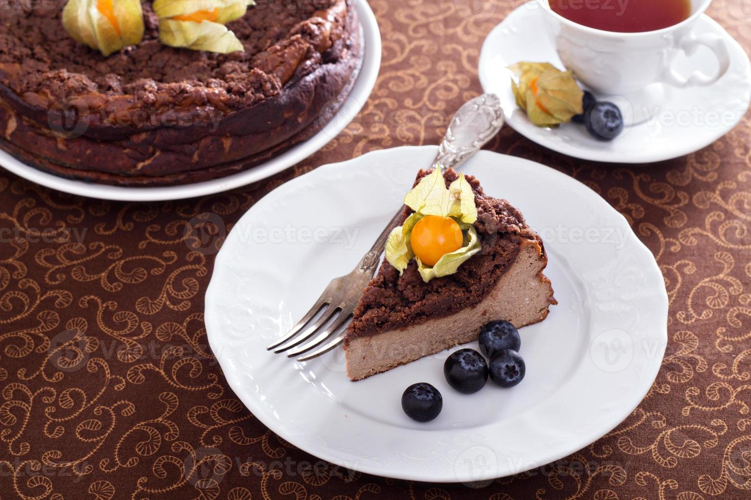 Chocolate cheesecake with crumb topping photo