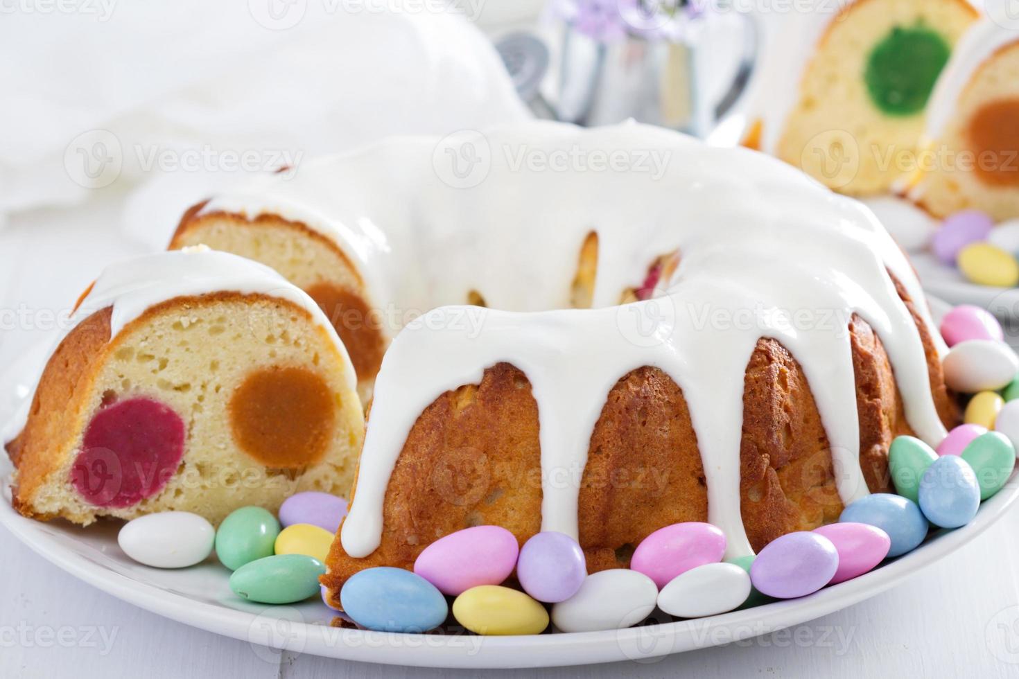 Easter cake with colorful filling and glaze photo