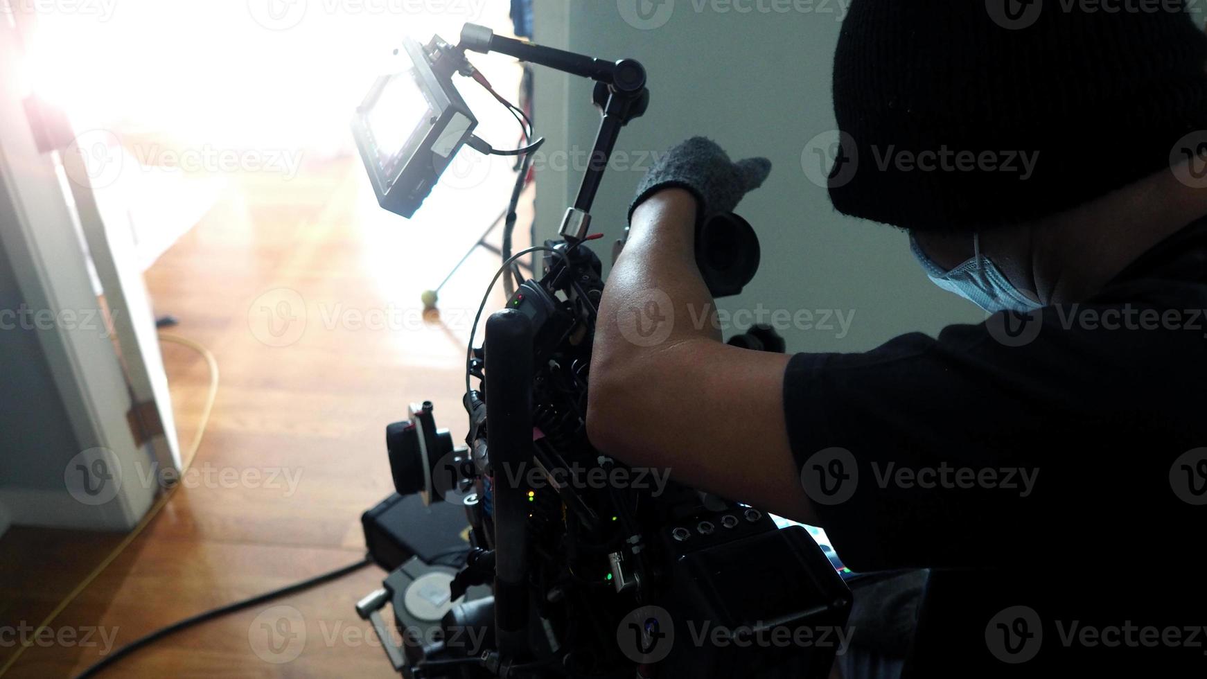 Behind the scenes of Videographer or photographer shooting video or movie production photo