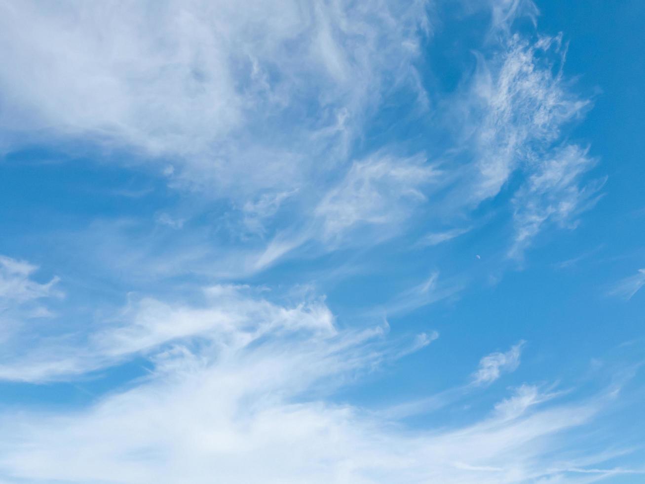 Blurred translucent clouds on the blue sky. photo
