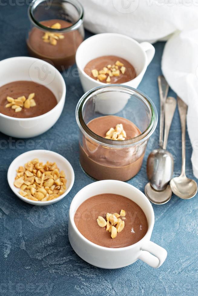 Chocolate yogurt dessert with salted peanuts photo