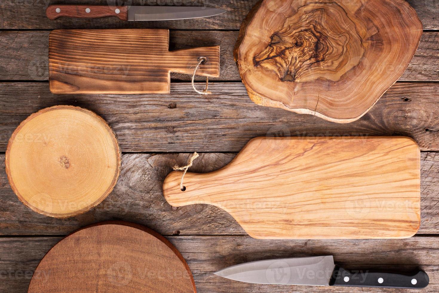 Wooden background with cutting boards photo