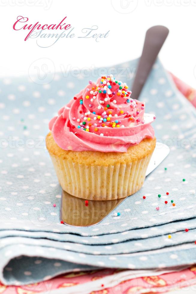 Cupcake with frosting and sprinkles photo