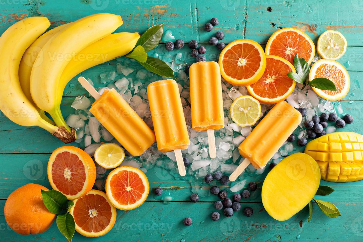 Mango banana popsicles on ice photo