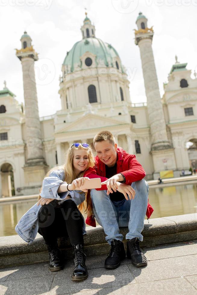 Young couple taking selfie in Vienna, Austria photo