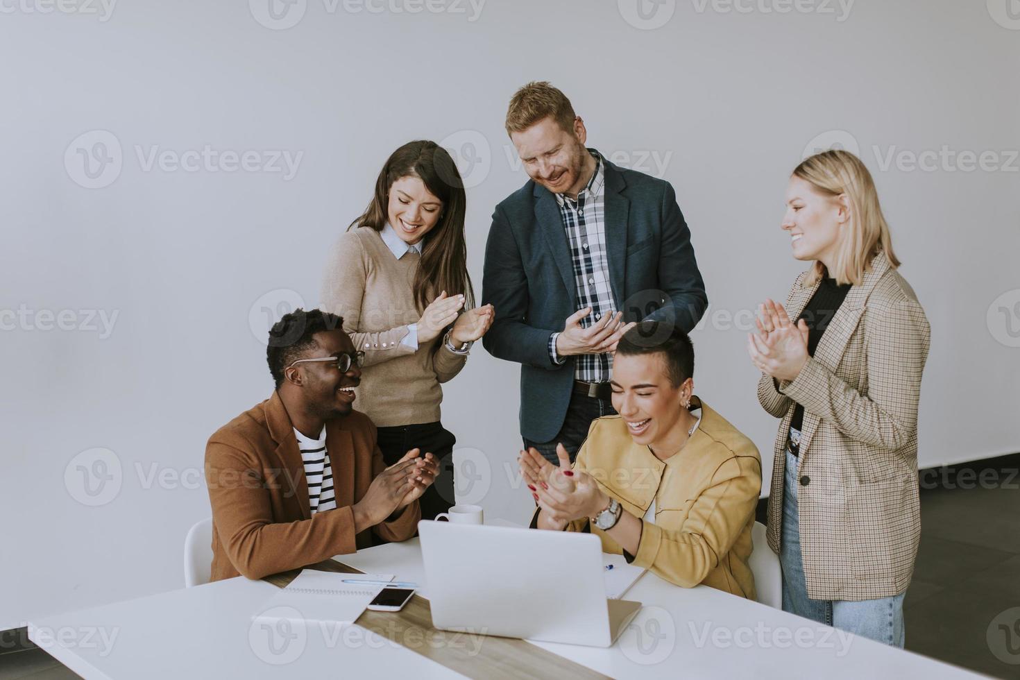 Group of multiethnic business people working together and preparing new project on a meeting in office photo