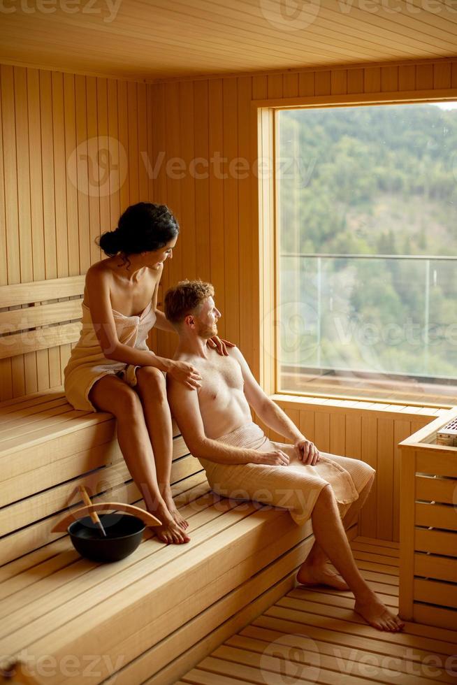 Young couple relaxing in the sauna photo